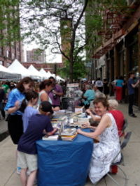 Picture of Beth signing books in front of Sandmeyer's book store during the Printer's Row Book Fair 