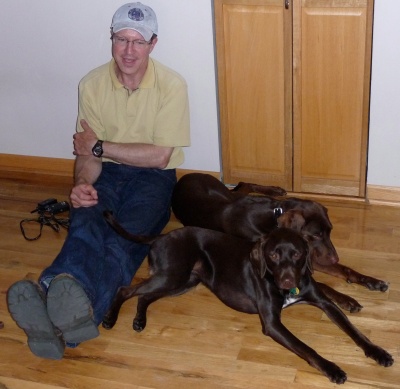 That's Greg with his and Lois' dogs Gamma and Griffin.