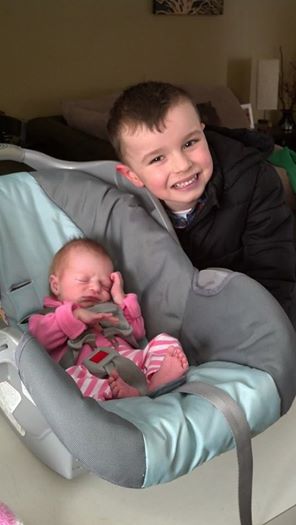That's Ella--her brother Bryce is happy to have a sister.
