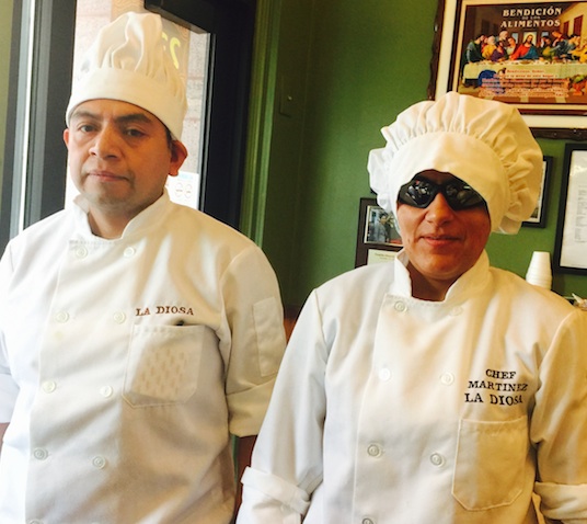 That's Chef Laura on the right, alongside her husband and fellow restaurateur Mauri.