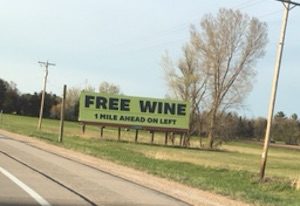 Picture of a billboard that says free wine.