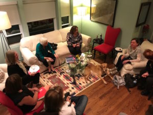 Photo of women gathered in a living room.