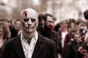 Photo of man made up to be a Zombie.