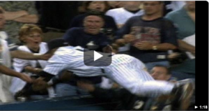 Still photo of Derek Jeter diving into the stands to catch a foul ball. Click to go to YouTube video.